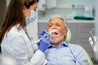 Geriatric patient undergoing dental examination