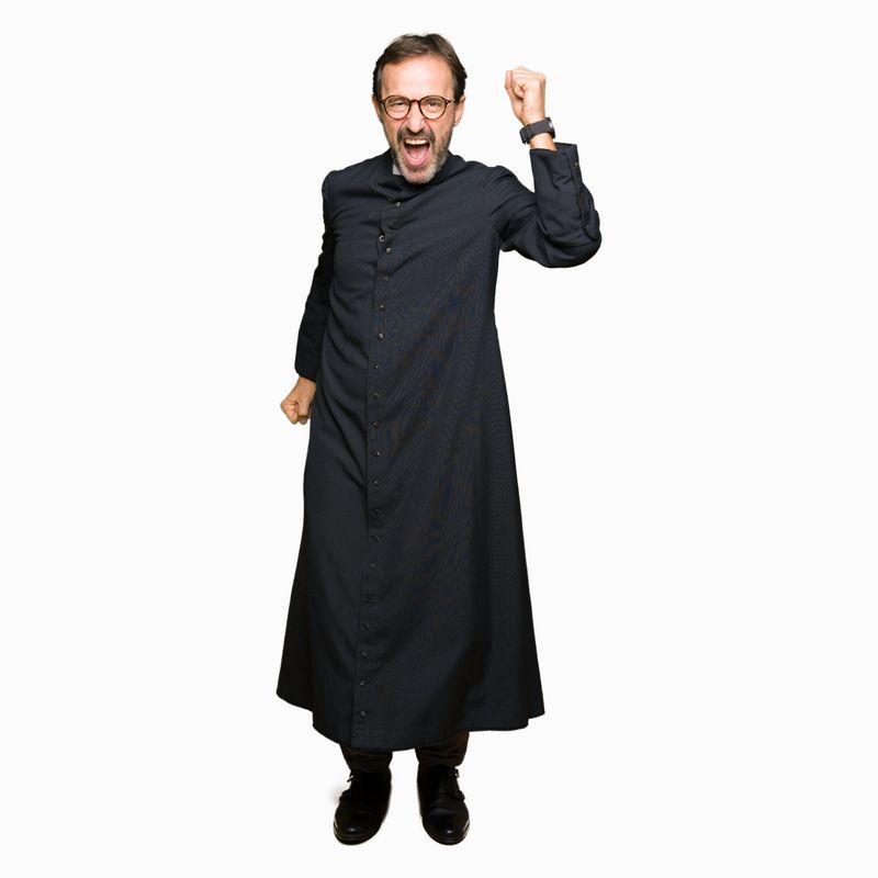 Middle age priest man wearing catholic robe Dancing happy and cheerful, smiling moving casual and confident listening to music