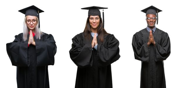 Three graduates with hands in prayer gesture.