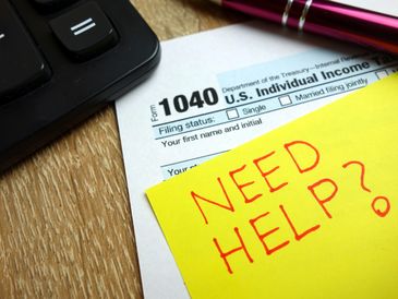 Tax preparation in York PA—IRS Form 1040 with reminder for professional help