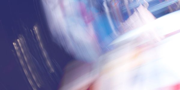 Abstract blurred image with motion and vibrant colors.