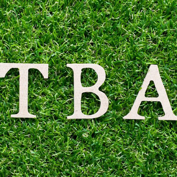 Letters TBA on green grass.