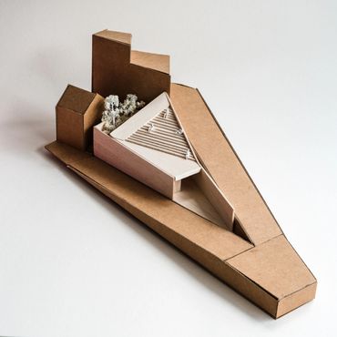 Architectural model of a modern building with angular design.
