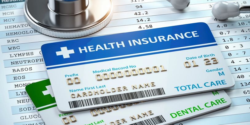 Health insurance cards on medical test results.
