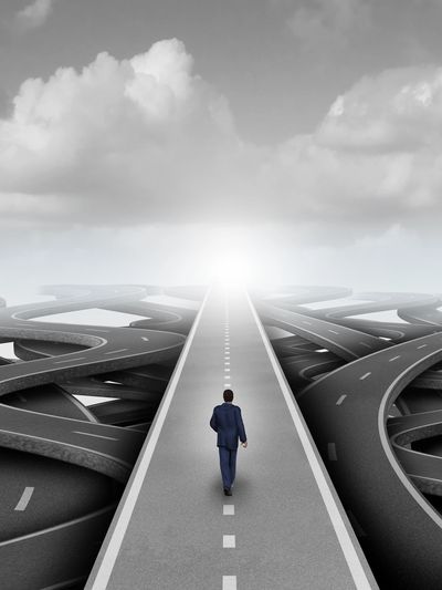 Person walking a clear path through a maze, represents ERP therapy and breaking the OCD cycle. 