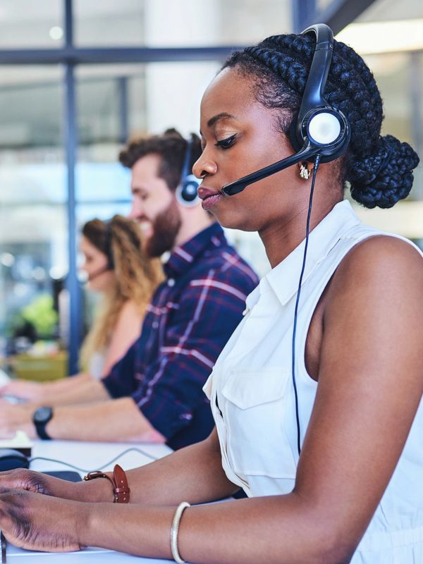 Diverse team of agents collaborating at their workstations.