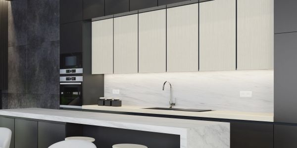 Sleek modern kitchen with marble countertops and minimalist cabinetry.
