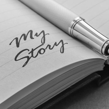 Pen and notebook with 'My Story' written.