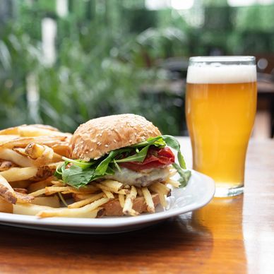 Burger with fries and a glass of beer.