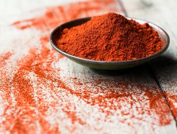 Bowl of red paprika powder.
