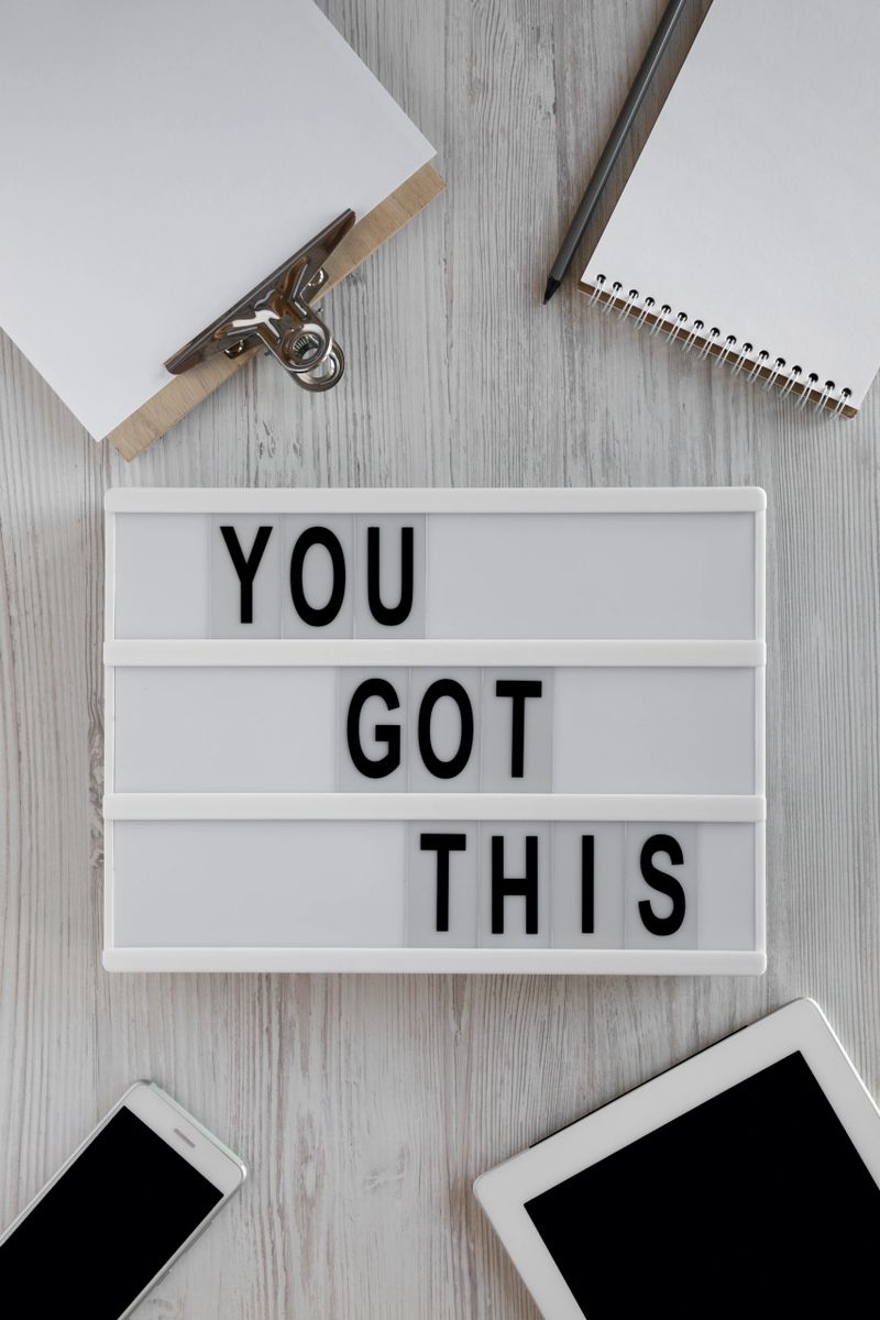 Modern board with 'You got this' words over white wooden background. Business concept. Overhead, top view, from above. Flat lay.