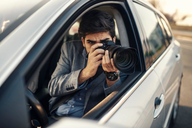 Close-up - Young Man Photorapher Sitting In The Car