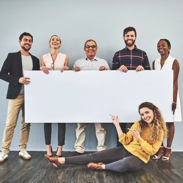 group of people holding sign