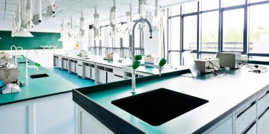 Modern scientific laboratory with clean workstations and equipment.