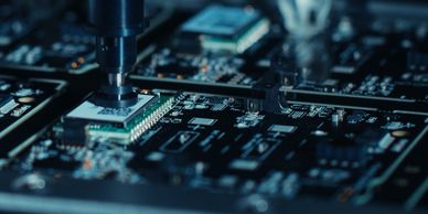 Machine assembling electronic circuit board.