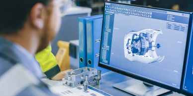Engineer working on 3D CAD design on computer.
