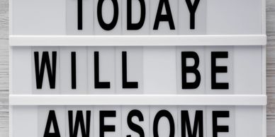 Motivational sign reads 'Today will be awesome' in bold black letters.