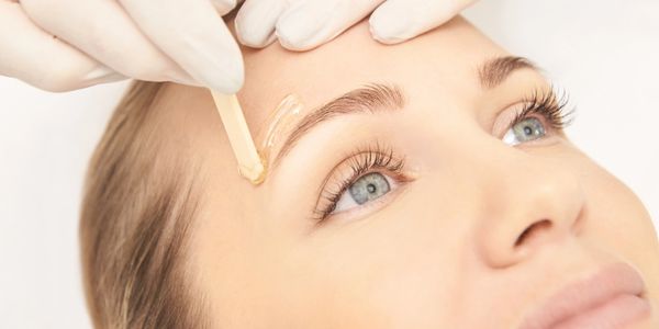 Woman getting the best brow waxing in Everett, WA at Autumn Noel Esthetics.