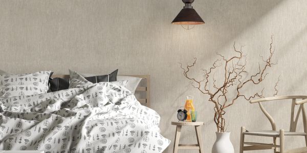 Cozy bedroom with natural wood furniture and soft lighting.