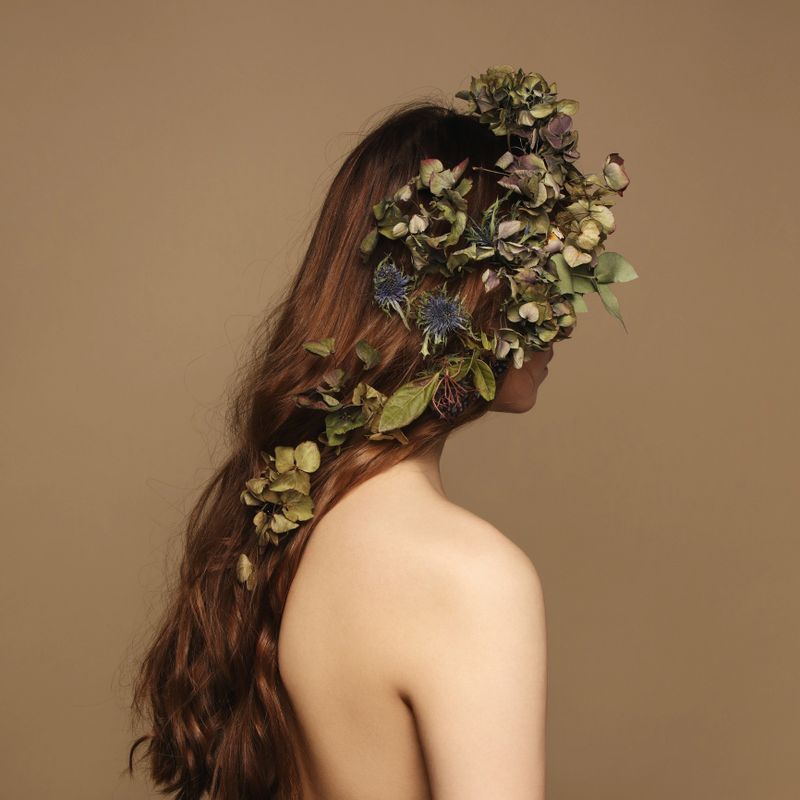 Portrait of woman with flowers in her hair