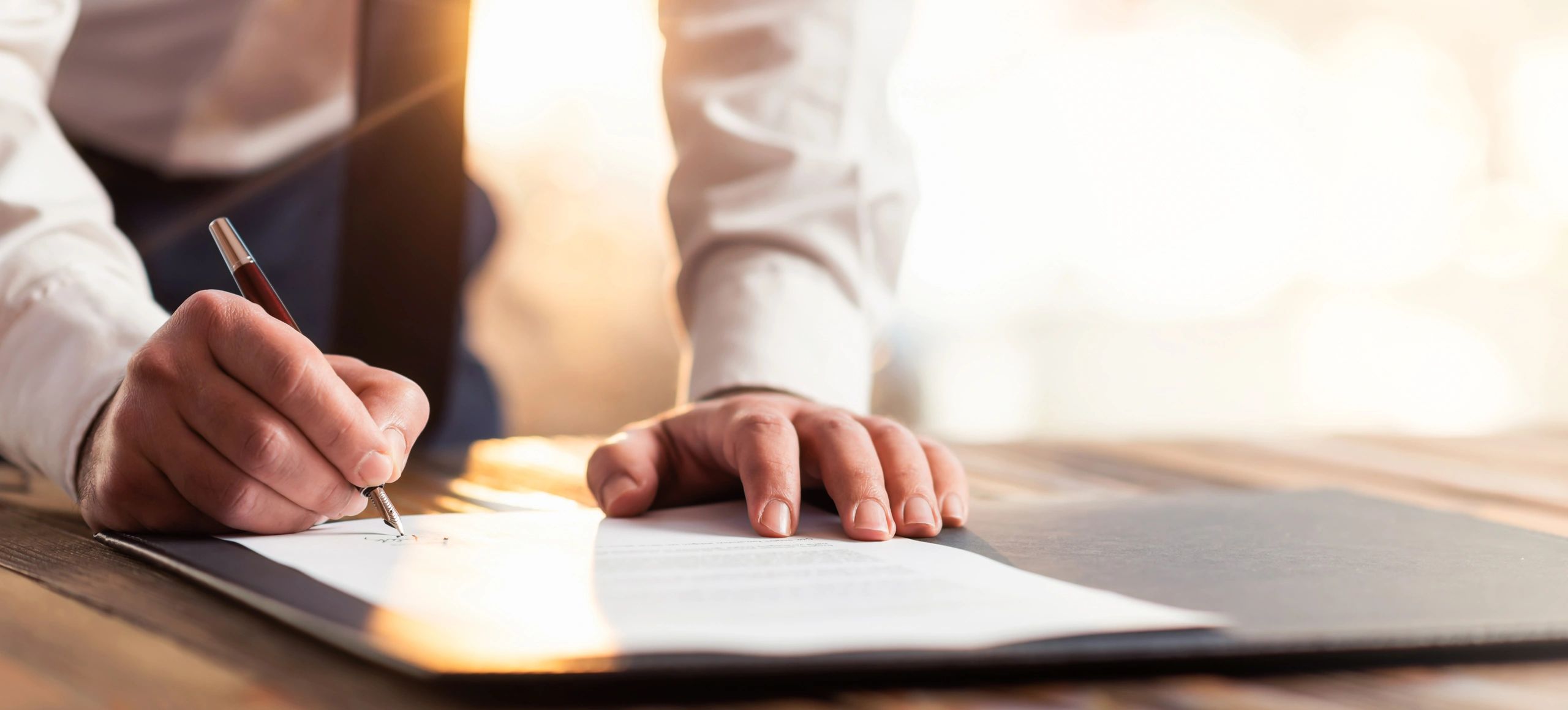 Man signing an agreement