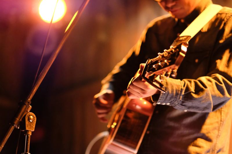 Singer-songwriter singing songs at live stage in Tokyo, Japan
