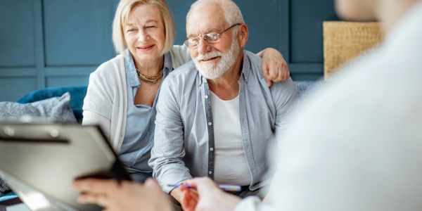 Elderly couple consulting with a professional.