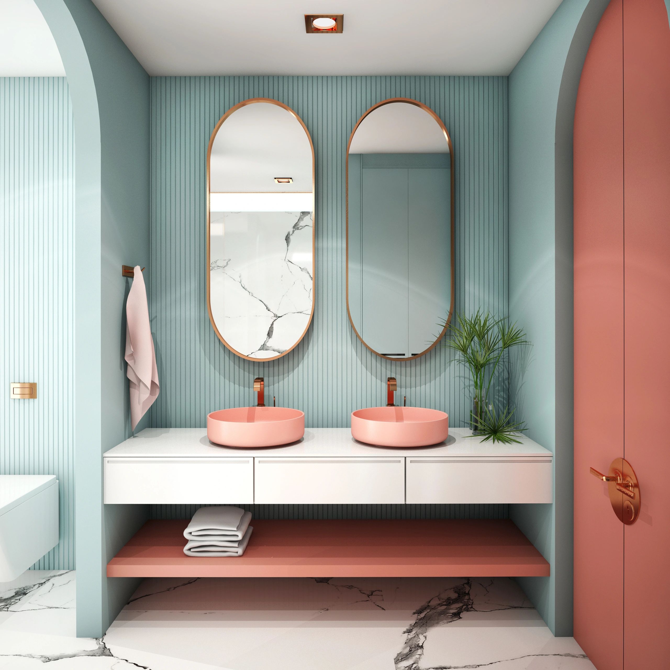 Modern bathroom with pink sinks and teal walls.