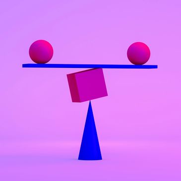 Abstract geometric shapes balanced in vibrant pink and blue hues.