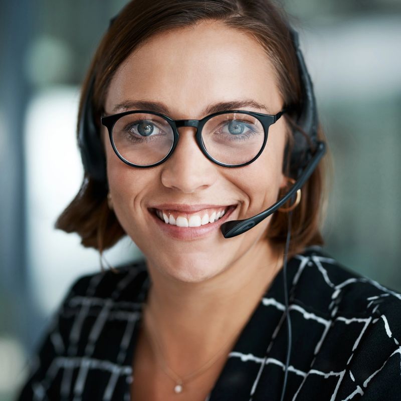 Cropped portrait of a happy young call centre agent working in an office