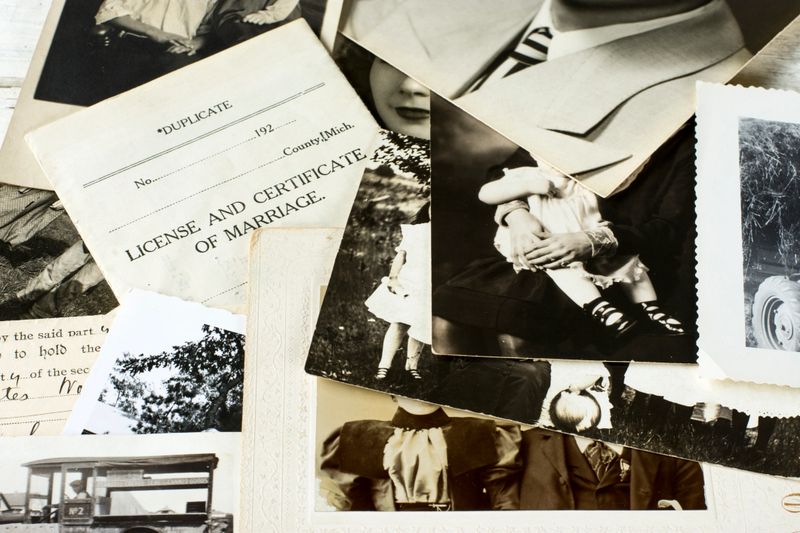 Genealogy family history theme with old family photos and documents.
