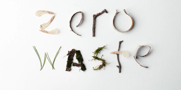 Words 'zero waste' spelled with natural materials like twigs and leaves.