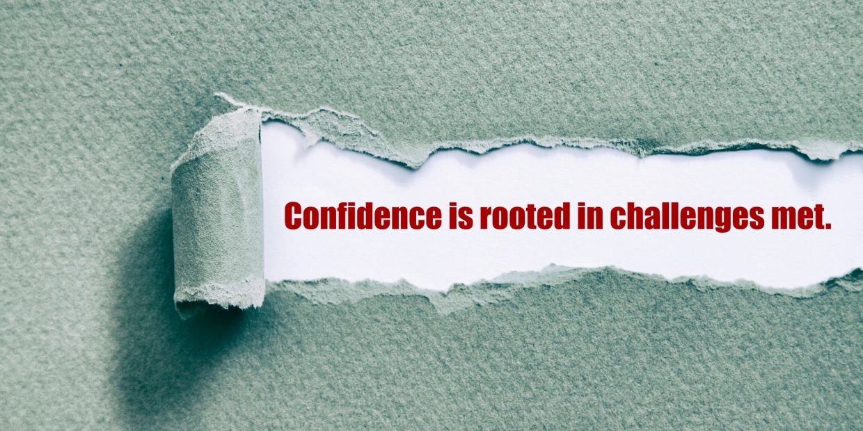 Torn paper revealing a motivational quote.