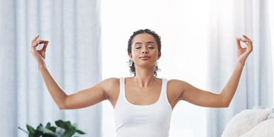 Woman doing meditation in the house