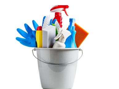 Bucket filled with cleaning supplies and gloves.