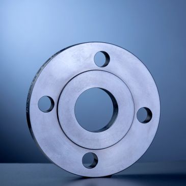 Metal flange with four bolt holes.