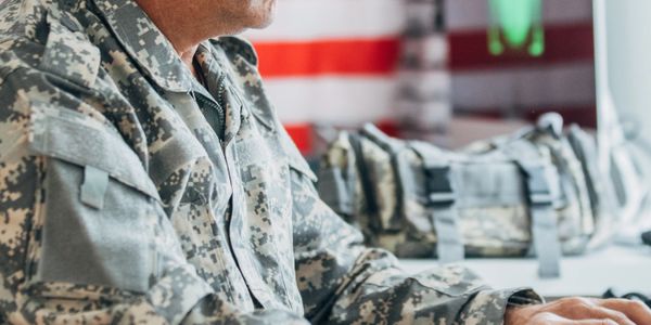 Military member working on their online business.