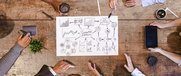 Professional team collaborating on strategy in a meeting.