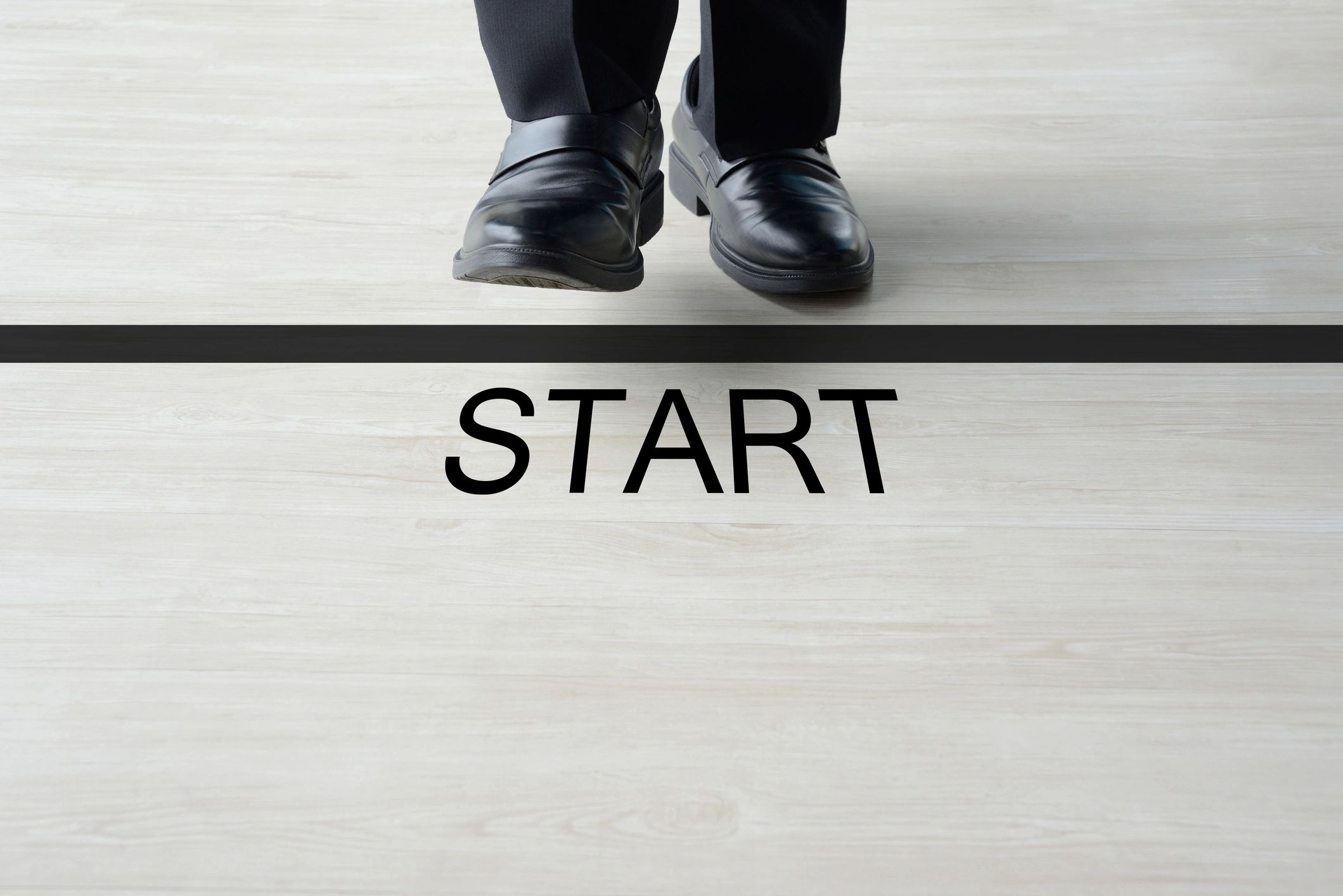 Business man standing on starting line