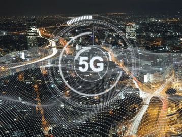 5G technology concept over cityscape at night.