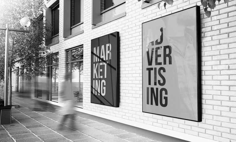 Yellow advertising banners hang on poles in a sunny urban street.