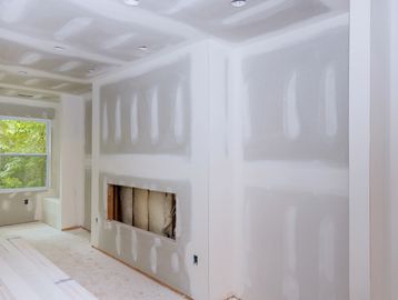 Room under construction with drywall.
