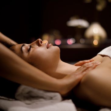 Woman enjoying a relaxing massage at a spa.