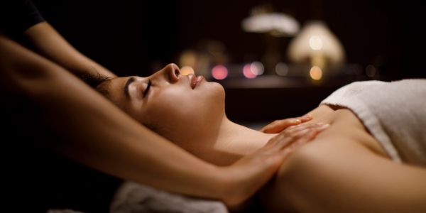 Woman receiving a relaxing shoulder massage.