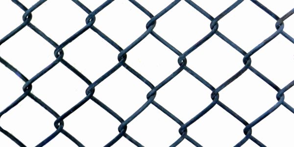 Close-up of a chain-link fence with a white background.