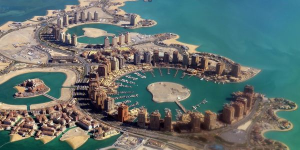 Aerial view of artificial islands and buildings.