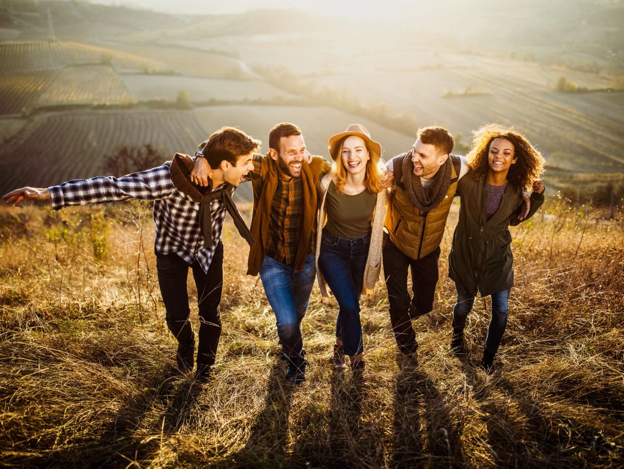 Group of friends enjoying autumn outdoors.