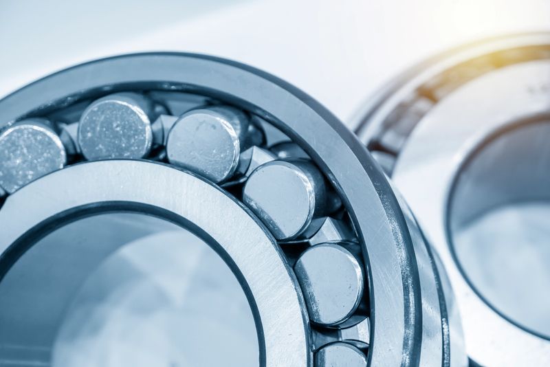 Close-up scene of rolling bearing with lighting effect. The mechanical parts manufacturing concept.