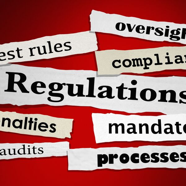 Torn paper strips with regulation-related words on red background.
