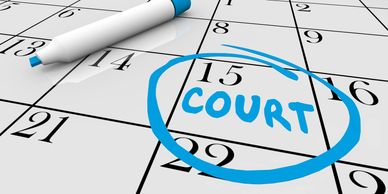 Calendar date circled with blue marker and word 'COURT' on the 15th day.